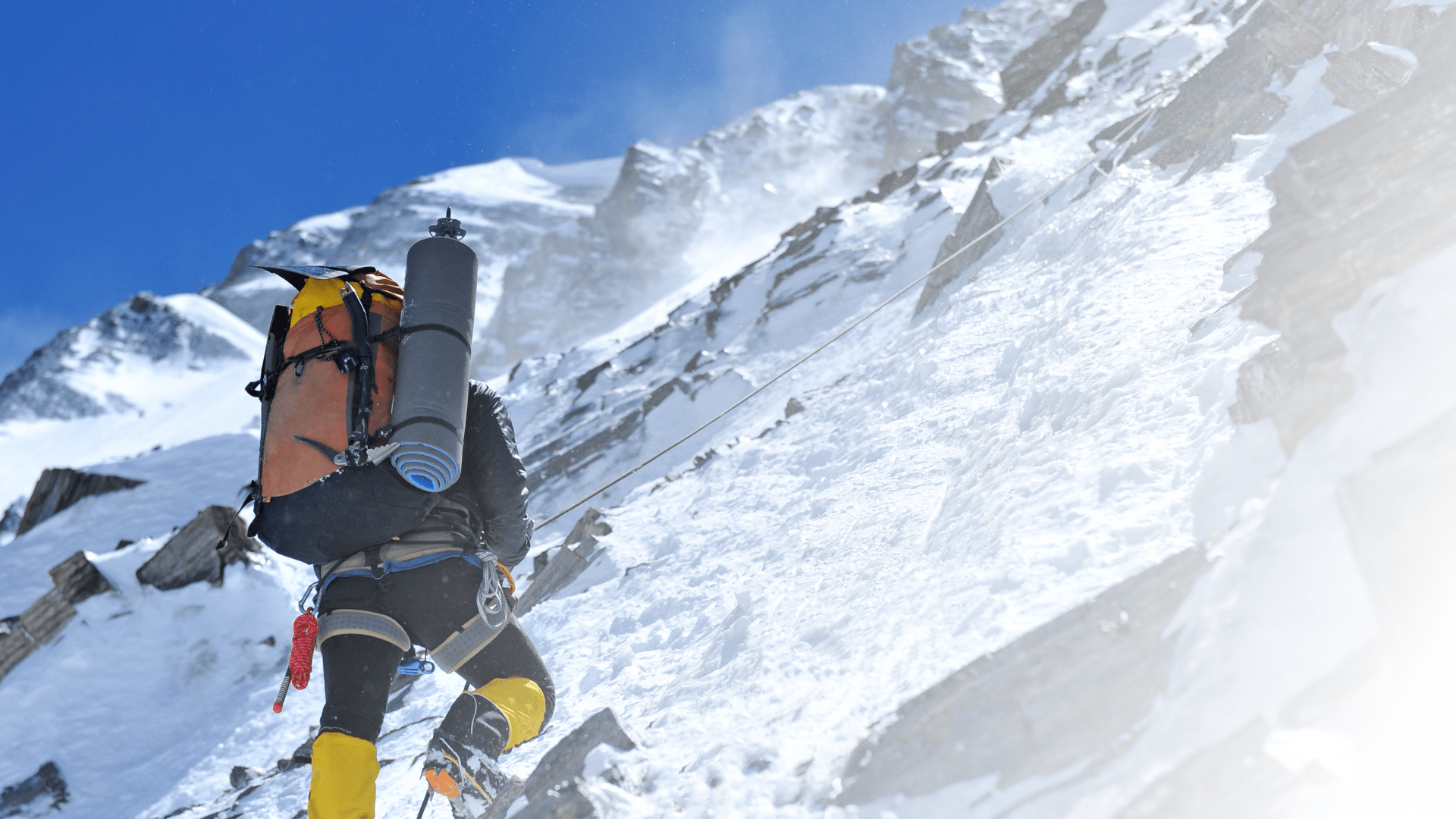 person climbing a mountain